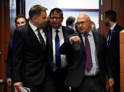 El acuerdo se dio luego de 11 horas de extenuantes negociaciones. AFP / J. Thys