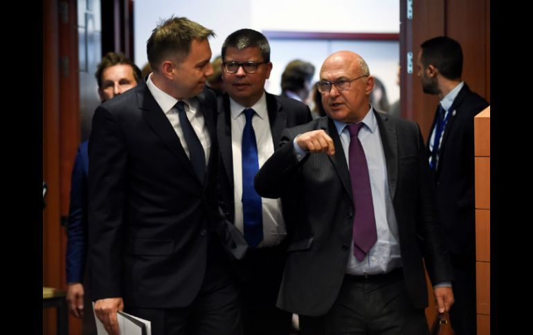 El acuerdo se dio luego de 11 horas de extenuantes negociaciones. AFP / J. Thys