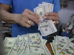 El Banco de México fijó el tipo de cambio para solventar obligaciones en 18.4572 pesos. EL INFORMADOR / ARCHIVO