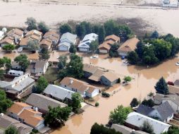 Varias viviendas en remolques fueron arrastradas por la corriente y algunas casas tenían agua dentro. EFE / ARCHIVO