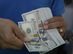 El Banco de México informa que el tipo de cambio para solventar obligaciones se ubida en 18.4118 pesos. EL INFORMADOR / ARCHIVO