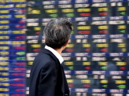 La misma tendecia a la baja es reportada por el Nasdaq Composite, el Standard & Poor's y el NYSE Composite. AFP / K. Nogi