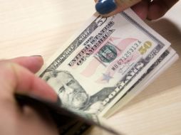 La divisa norteamericana tiene un alza de 12 centavos respecto al precio de su apertura. EFE / ARCHIVO