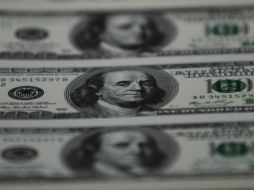 La institución prevé que el tipo de cambio en México se mantenga entre 18.40 y 18.50 pesos por dólar. AP / ARCHIVO