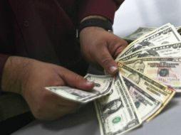 El Banxico  ubica en 18.1491 pesos el tipo de cambio para solventar obligaciones en moneda extranjera. NTX / ARCHIVO