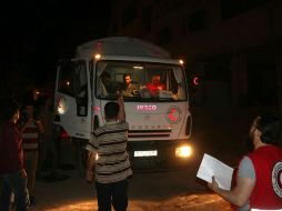 La distribución de la ayuda no pudo completarse entre los habitantes de la urbe debido a los bombardeos. AP /