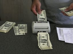 Para este jueves, se estima que el tipo de cambio cotice entre 18.90 y 19.10 pesos por dólar. AP / ARCHIVO