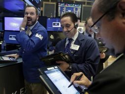 Wall Street subió levemente el martes con los inversores serenos pero prudentes. AP / ARCHIVO