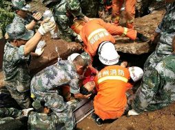 El corrimiento de tierra ocurrió en el pueblo de Pianpo, tras las precipitaciones que han afectado a la zona en los últimos días. AFP /