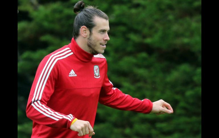 Sobre Gareth Bale, Chris Coleman destaca su juego colectivo. EFE / E. Lemaistre
