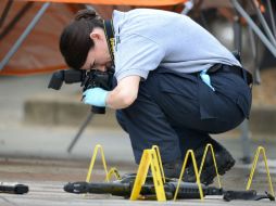 Agentes de la Oficina de Investigaciones de Tennessee investigan distintas escenas del crimen para esclarecer los hechos. AP / D.Crigger