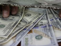 El tipo de cambio para solventar obligaciones denominadas en moneda extranjera pagaderas en el país es de 18.6022 pesos. EL INFORMADOR / ARCHIVO