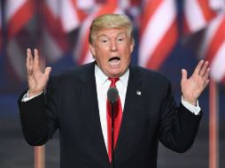 En rueda de prensa, el magnate califica de ''fraude'' las versiones acerca de que es amigo del presidente ruso y que lo admira. AFP / J. Watson