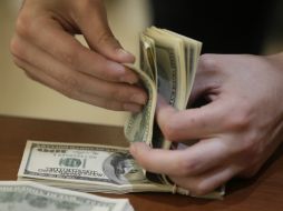 Para este miércoles, estiman que el tipo de cambio cotice entre 18.85 y 19.05 pesos por unidad. AP / ARCHIVO