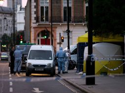 Elementos de la Policía Forense trabajan en la escena del crimen. AFP / J. Tallis