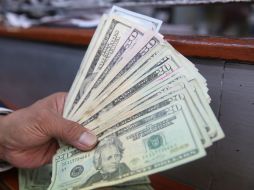 El tipo de cambio para solventar obligaciones denominadas en moneda extranjera pagaderas en el país se ubica en 18.8612 pesos. EL INFORMADOR / ARCHIVO