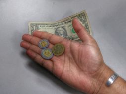 El tipo de cambio para solventar obligaciones denominadas en moneda extranjera pagaderas en el país es de 18.8691 pesos. EL INFORMADOR / ARCHIVO