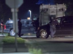 Policías vigilan el área donde se produjo el enfrentamiento, en la localidad de Strathroy. AP / G. Robins