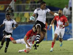 Acción del partido entre Fijiy Gran Bretaña en el Rugby 7. AP / R.Bukaty