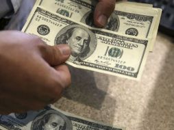 El Banxico fija el tipo de cambio para solventar obligaciones denominadas en moneda extranjera en 18.0363 pesos. AP / ARCHIVO