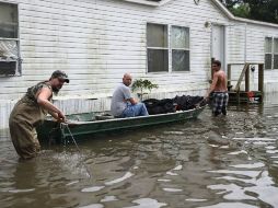 Las inundaciones han dejado al menos 13 muertos y han afectado a unos 40 mil hogares. AFP / J. Raedle
