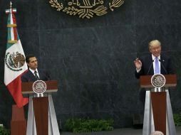 Trump no pidió perdón frente a Peña Nieto por sus insultos a mexicanos, y refrendó su plan de construir un muro fronterizo. AP / M. Ugarte