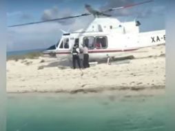 Un helicóptero aterrizó ilegalmente en el Área Natural Protegida Arrecife Alacranes, frente a la costa de Yucatán. YOUTUBE / PolakasTV