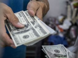 En bancos capitalinos, la divisa se vendió en 18.47 pesos. EL INFORMADOR / ARCHIVO