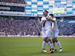 Ángel Zaldivar y sus compañeros celebran la primera anotación del partido que llegó por la vía del penal. MEXSPORT / J. Ramírez
