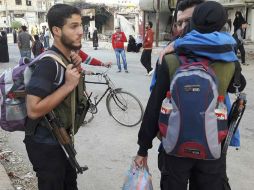 El Observatorio Sirio de Derechos Humanos asegura que ninguna persona a dejado la ciudad, pues en los corredores hay francotiradores. AP /