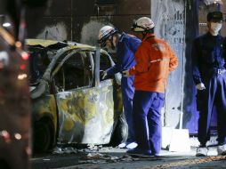 En un estacionamiento varios coches ardieron tras oirse una segunda explosión. EFE / K. Mayama