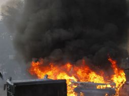 Los manifestantes amenazaron con incendiar los autos de los burócratas y el edificio central. EFE / ARCHIVO