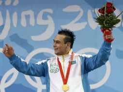 Entre los descalificados, el kazajo Ilya Ilin, medalla de oro en halterofilia en ambos juegos. AP / ARCHIVO