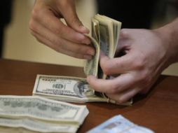 El Banco de México fijó el cambio en 20.6225 pesos. AP / ARCHIVO