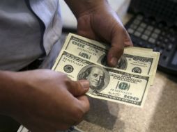 El Banco de México fijó el cambio en 20.3305 pesos. AP / ARCHIVO