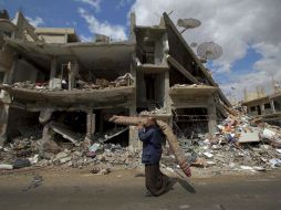 Tres mil 500 personas abandonaron en las últimas horas zonas del este de Alepo. AFP / H. Ammar