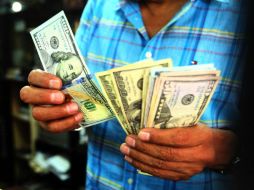 La moneda norteamericana alcanza un máximo de 20.98 pesos y un mínimo de 19.58 pesos. EL INFORMADOR / ARCHIVO