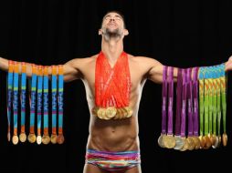 Phelps aparece con la frase 'El mejor deportista olímpico de la historia'. ESPECIAL / www.si.com