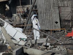 Peritos del Estado de México continúan las labores periciales fotográficas, de campo y forenses. EFE / A. Cruz