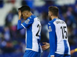 Reyes (I) López (D) durante el partido de hoy. EFE / A. García