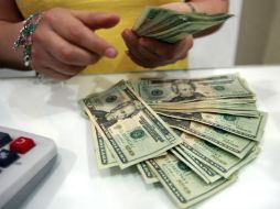 El tipo de cambio  de acuerdo con Banxico es de 20.7052 pesos. EL INFORMADOR / ARCHIVO