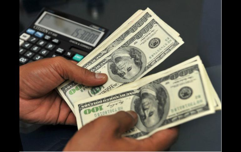 Estiman que para este día el tipo de cambio cotice entre 20.60 y 20.80 pesos por dólar. AFP / ARCHIVO