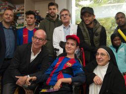 La visita por parte de miembros del club azulgrana se enmarca en la campaña del Barcelona ''Un sueño para un regalo''. AFP / J. Lago