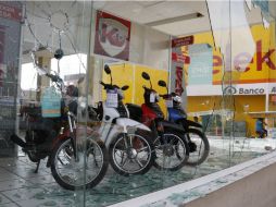 Aspecto de las afectaciones a negocios luego de las acciones de saqueo perpetradas por diversos grupos de personas. SUN /