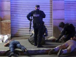 Policías veracruzanos detienen a sospechosos de saqueos. AP / F. Márquez