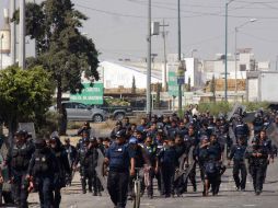 El despliegue policiaco derivó en enfrentamiento con los saqueadores. SUN / O. Contreras