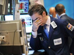 Wall Street regresa con números rojos después de un largo fin de semana por el feriado de Martín Luther King. AFP / ARCHIVO