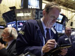 Wall Street cerró hoy con pérdidas y el Dow Jones de Industriales, bajó y acumuló cinco jornadas en números rojos. AP / ARCHIVO