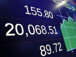 El índice Dow Jones se colocó en 20 mil 086.10 unidades, y por primera vez en su historia supera la barrera de los 20 mil puntos. AP / R. Drew