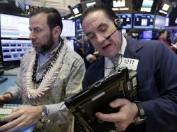 Los operadores en el parqué neoyorquino protagonizaron una sesión de altibajos que terminó con sus tres indicadores al alza. AP / ARCHIVO